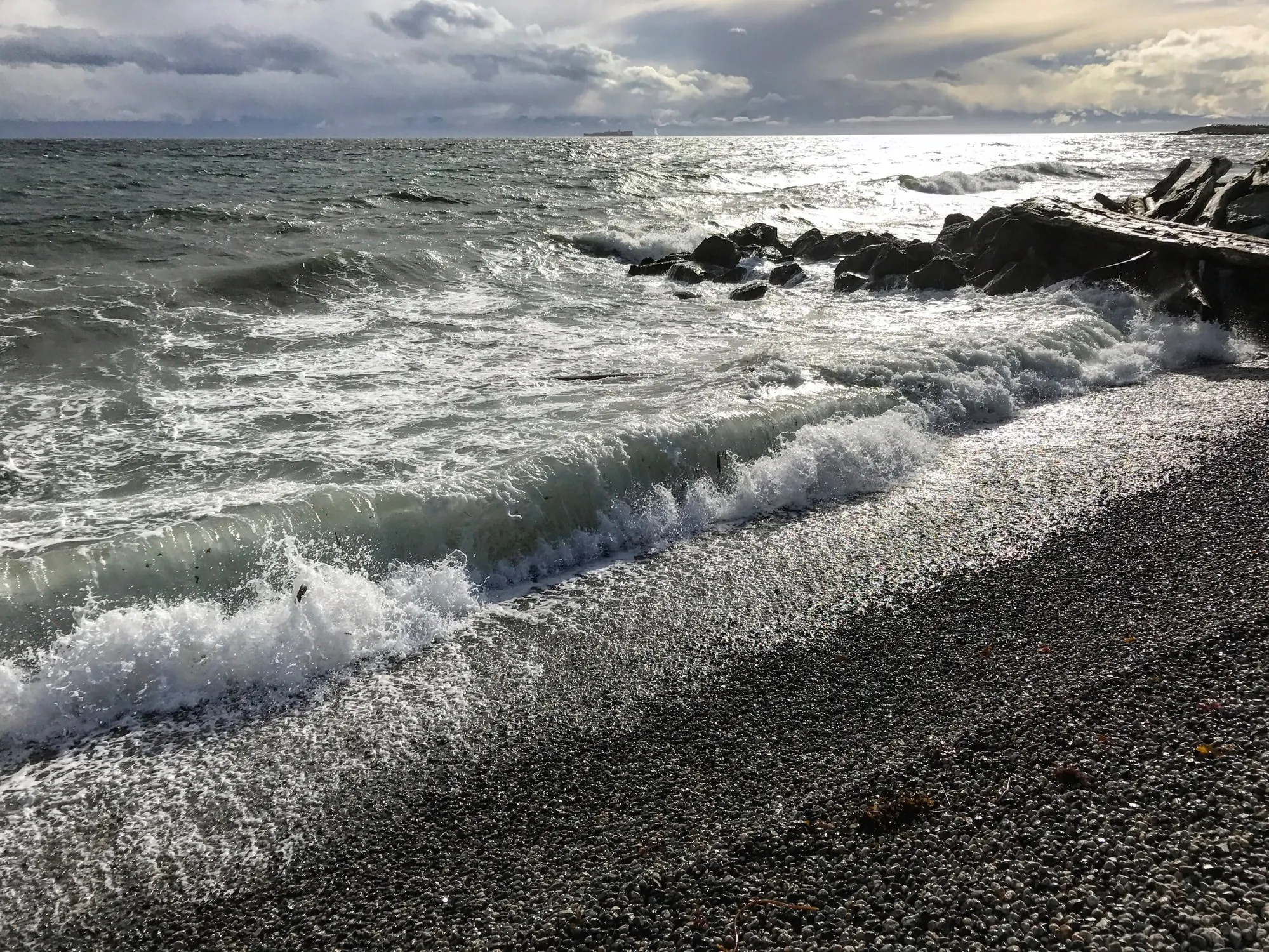 Waves breaking on a pebble beach on Vancouver Island